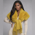 Woman modeling Sir Fredericks faux fur pashmina scarf styled as an elegant winter accessory.